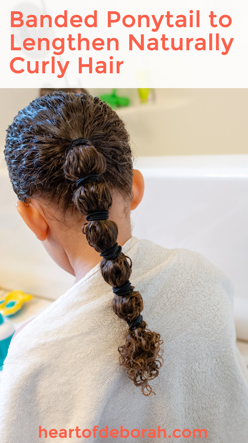 Use a banded ponytail to lengthen naturally curly hair without heat! Everything You Ever Wanted to Know About Curly Hair Care For Kids #biracialhair #naturallycurlyhair #curlyhaircare #mixedhair 