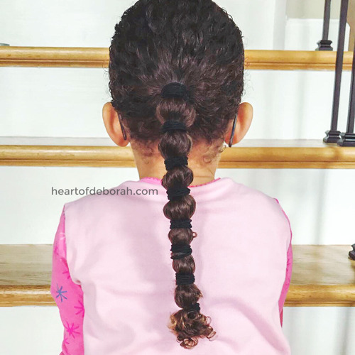 Not sure how to care for your children's curly hair? In this post we share the best curly hair routine for moisture and curl definition. Our daughter is biracial and has dense curls! Throughout the years we've found products that work the best to keep her hair healthy. #curlyhair #curls #kidscurls #biracialhair