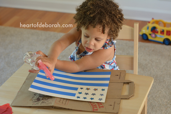 Fun American Flag Kid's Craft! Make this beautiful watercolor with your children for memorial day, the 4th of July or to cheer on Team USA at the olympics. This DIY watercolor is beautiful and easy to make with kids.