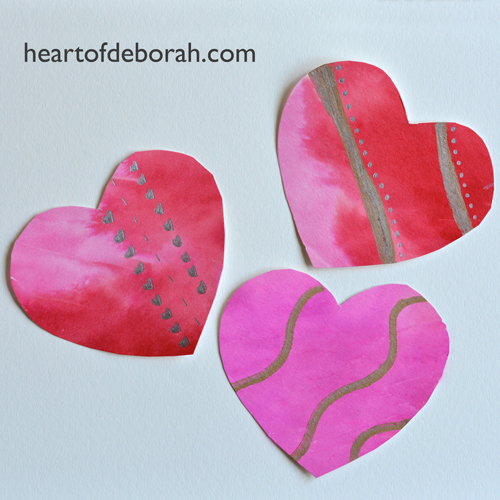 A fun and simple kid's craft to make watercolor hearts. Use tissue paper to create a beautiful watercolor heart design. You can use the hearts as Valentine's Day decorations or all year long as kid's bedroom decor!