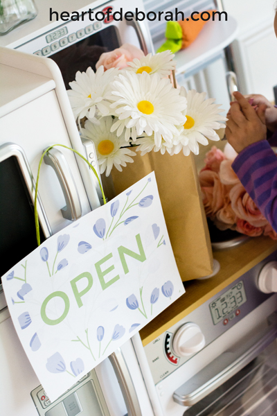 Looking for a spring themed dramatic play center? Create your own flower shop and garden. Kids will love buying and water their floral bouquets. Download the free printables included for an open/closed sign and a flower sign shop.