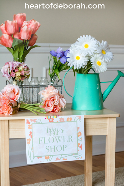 Looking for a spring themed dramatic play center? Create your own flower shop and garden. Kids will love buying and water their floral bouquets. Download the free printables included for an open/closed sign and a flower sign shop.