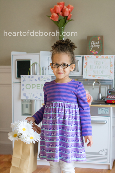 We made a DIY pretend play flower shop in our playroom and it was a hit. Our preschooler loved shopping for different flowers and using her cash register to check us out.