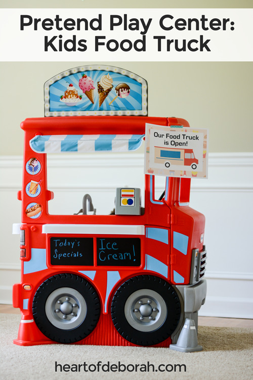 Awesome pretend play center for preschoolers! Build your own play food truck. Free menu and open sign printable to download! Your kids will love taking orders and ringing the bell when it's ready.